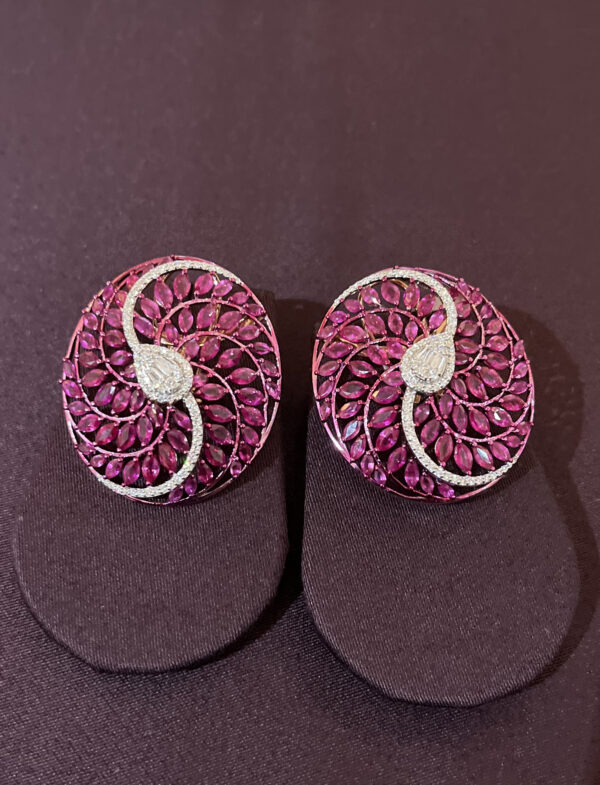 circular studs with swirl design